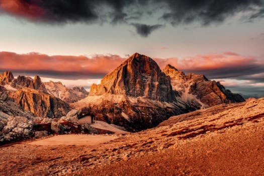 Breathtaking view of the Dolomites mountain range during sunset with vibrant skies.