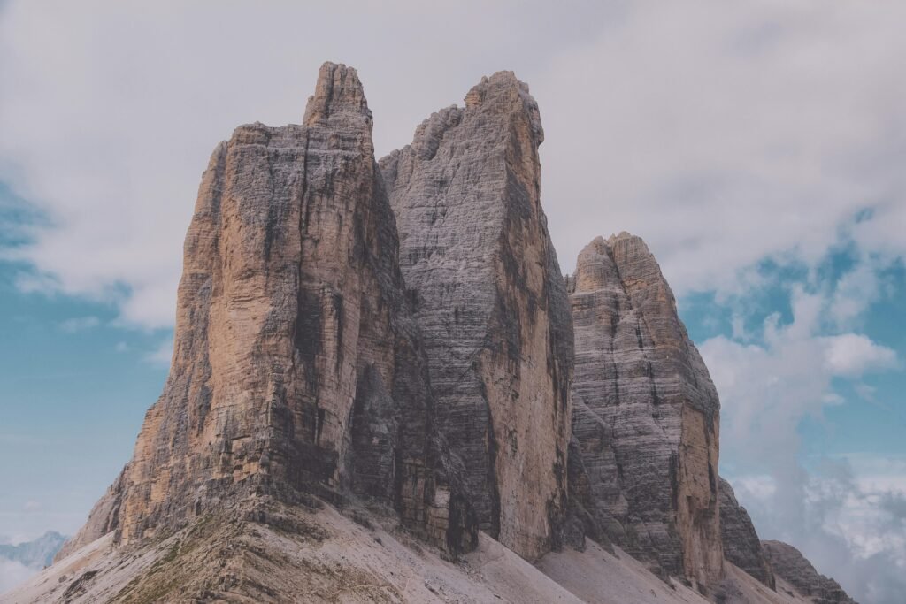 Stunning view of the Tre Cime di Lavaredo, Dolomites, under a clear sky.