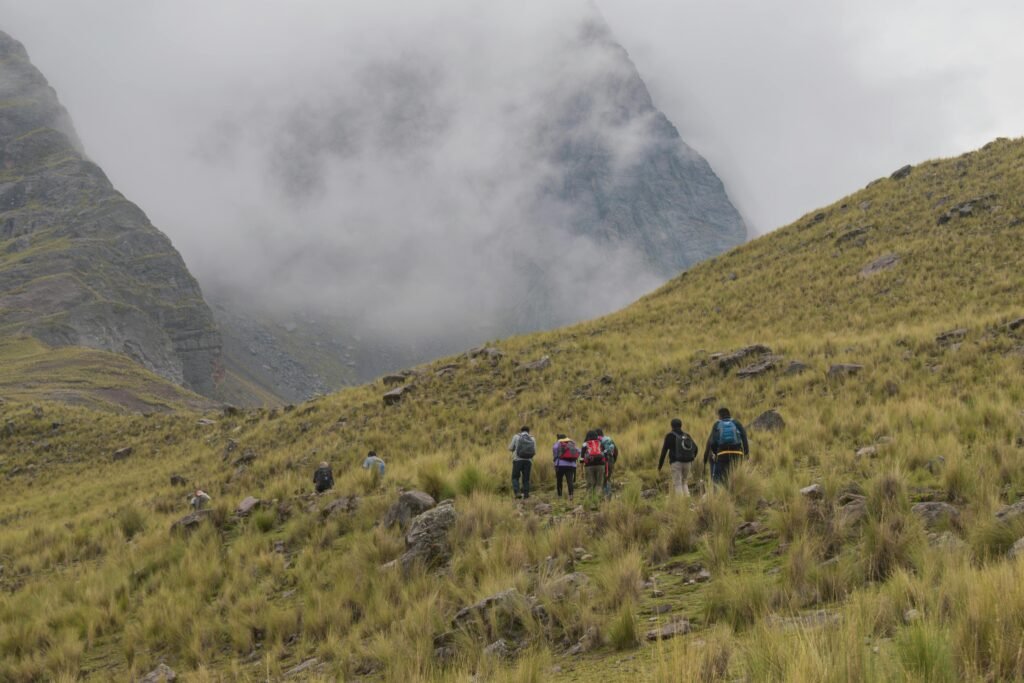 Group hiking in the majestic Andes mountains near Cusco, Peru.