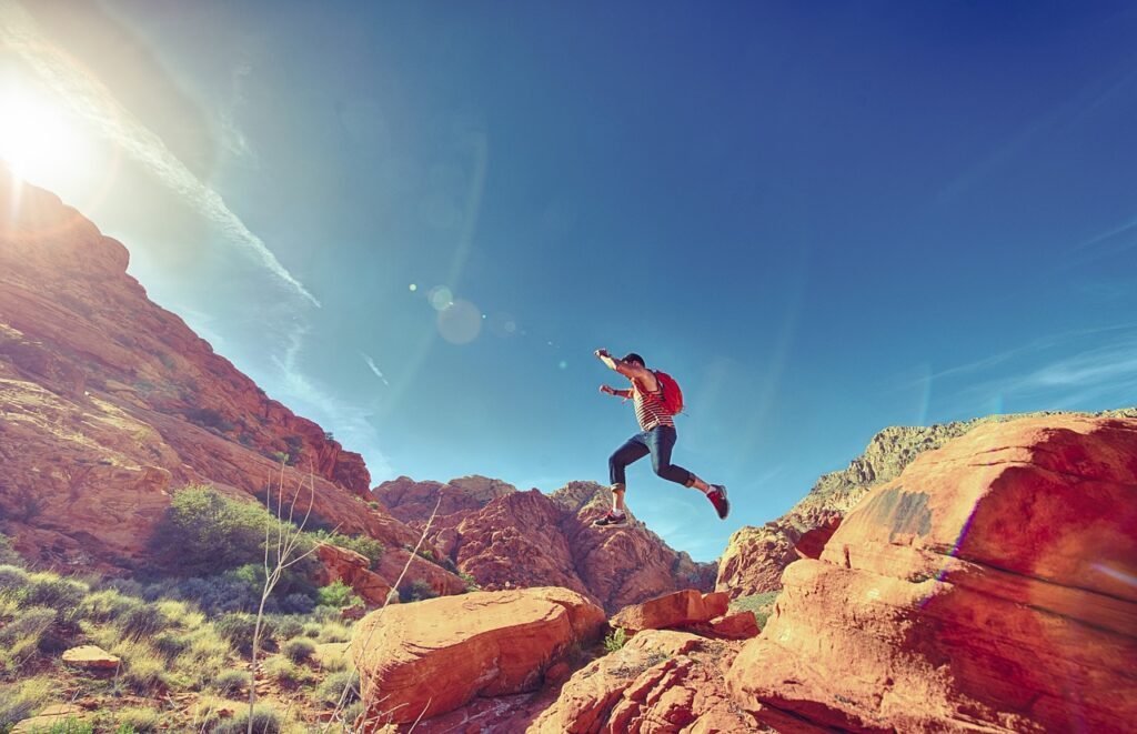 man, jumping, mountains