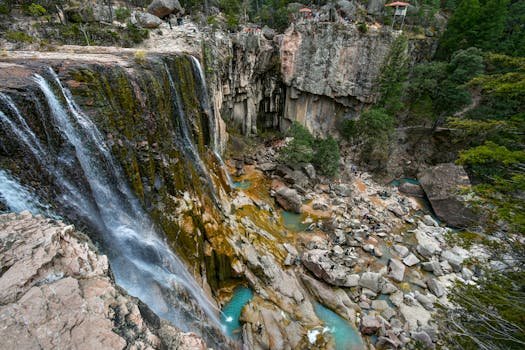 Stunning view of Cusarare Falls cascading over rocky cliffs in Guachochi, Mexico.